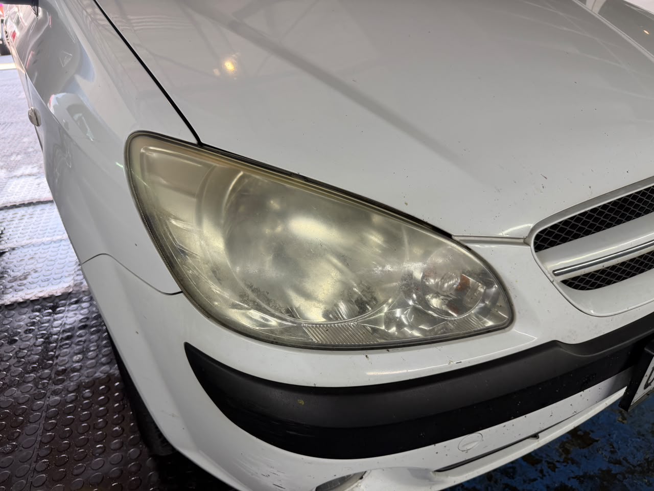 Cloudy headlight before restoration, left side